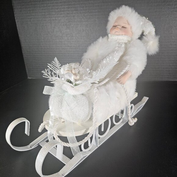All White Heritage Signature Collection Porcelain Baby Doll in Winter Sleigh - Picture 4 of 11